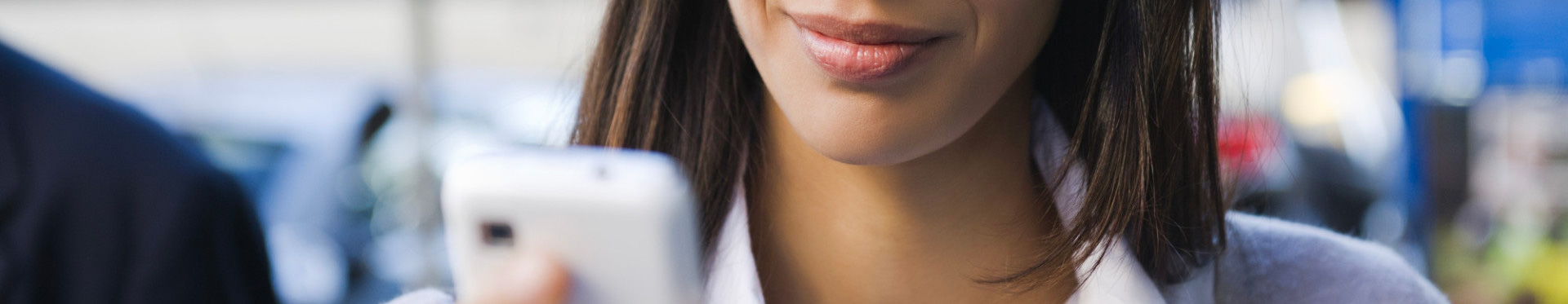 a woman reading a marketing message as a result of personalization