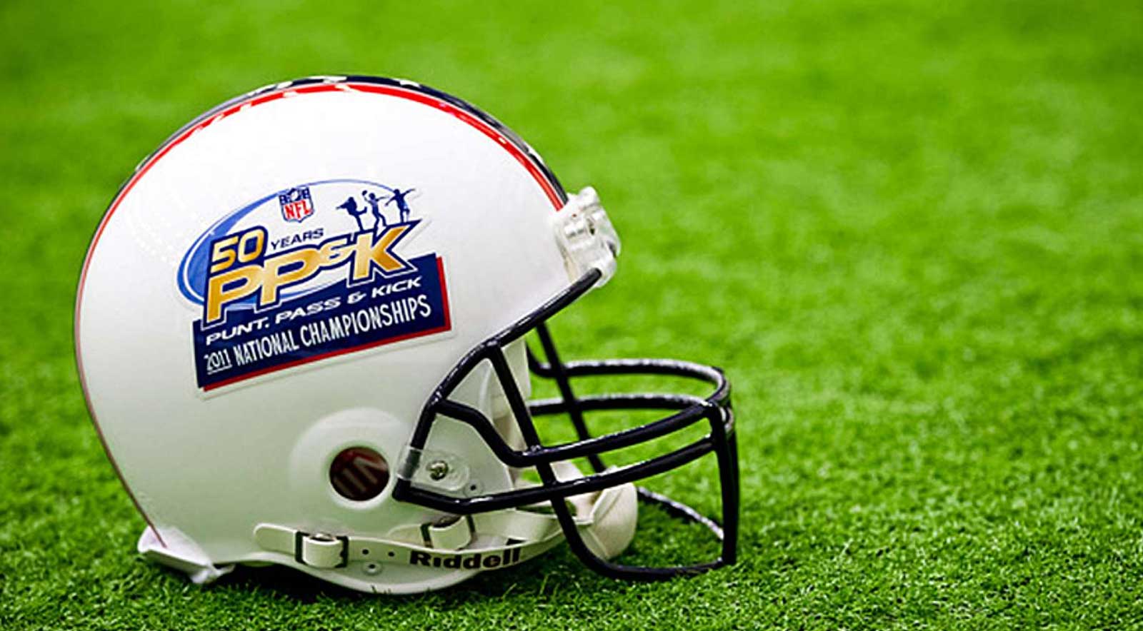 Football helmet sitting on grass