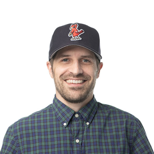 brent decker team member at orases wearing a baseball cap