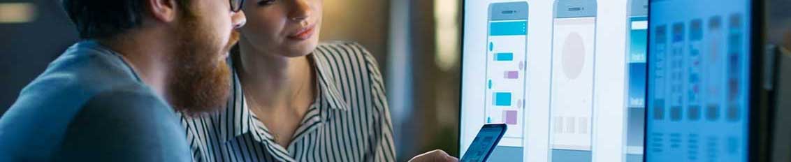 Man and woman performing software testing