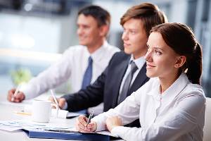 Three IT professionals during a custom software development project briefing
