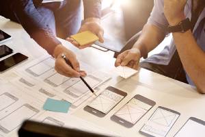 UX designers planning application for cross platform mobile development