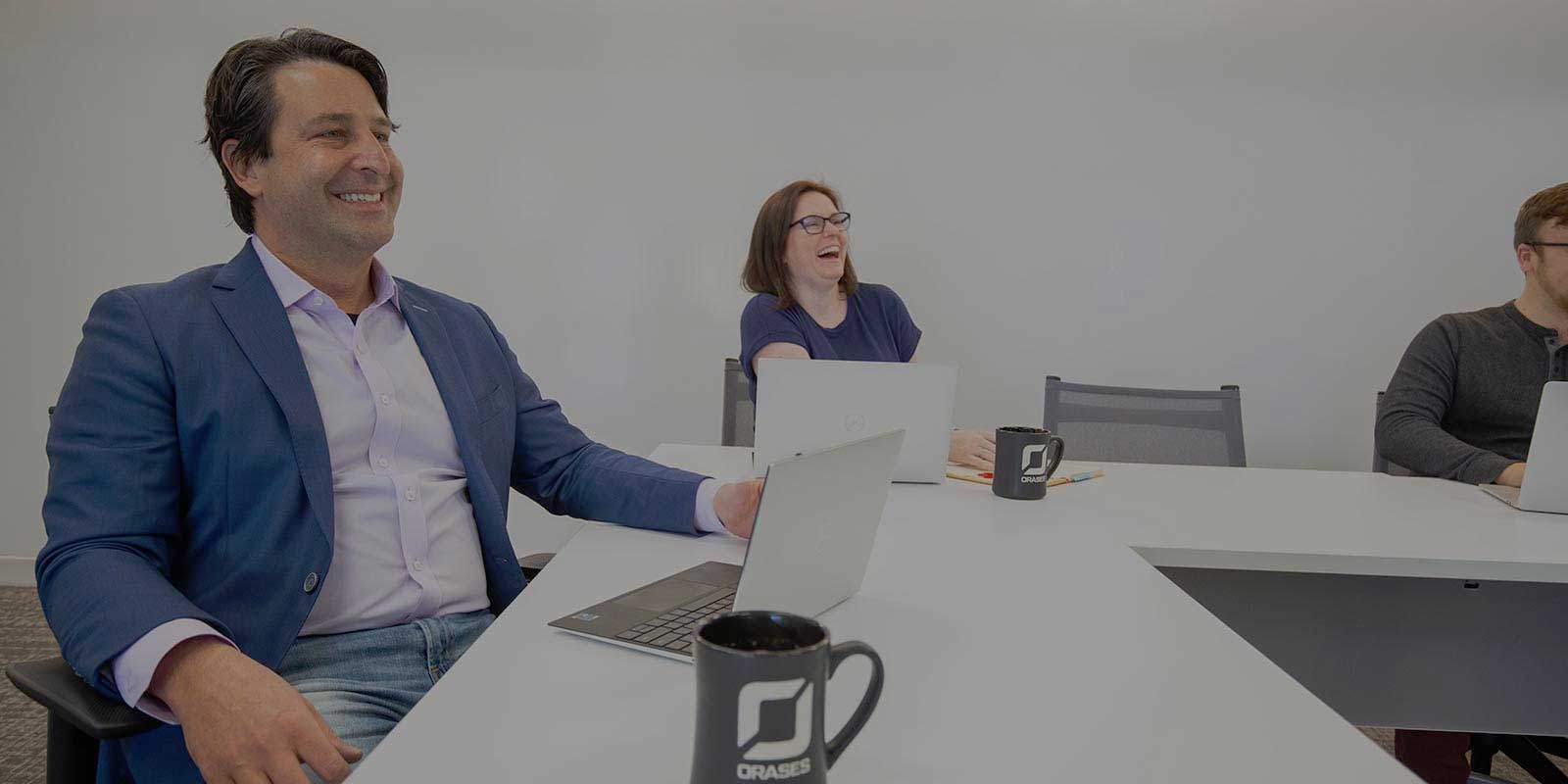 Nick and Orases employee reviewing a custom ERP software project