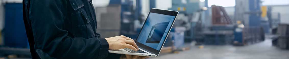 Employee in the manufacturing industry using custom ERP software