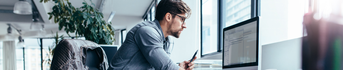 Man reviewing his ADA website compliance for 2022