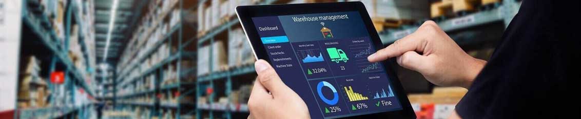 Employee using a custom warehouse management system