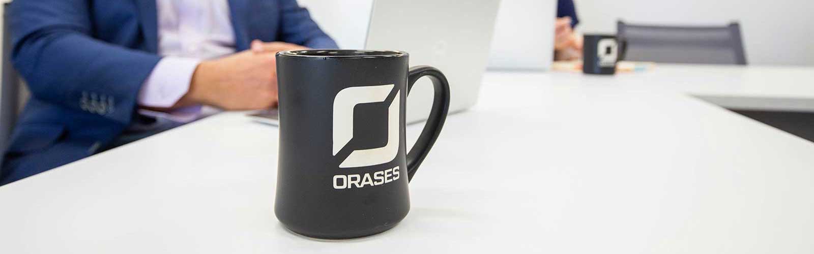 Orases mug in conference room
