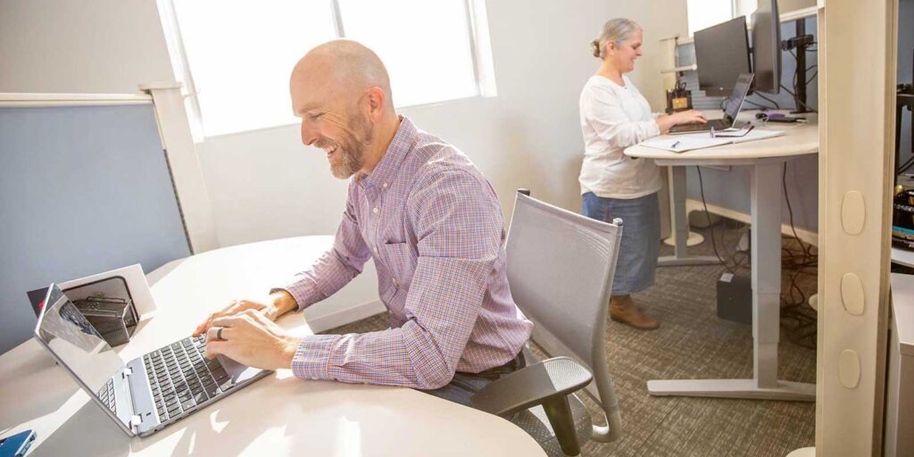 Two-system-integration-specialists-working