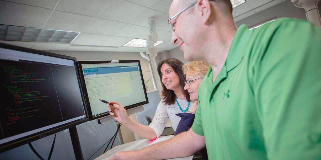 orases team members working on a subscription based website