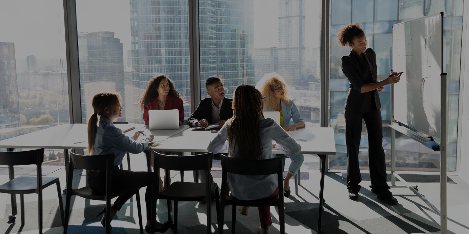 team of saas consultants working with an organization to discuss saas strategy
