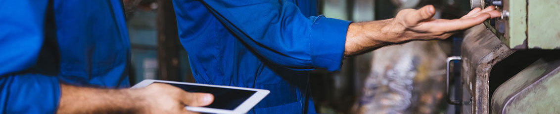Worker using a mobile application for field service management tasks