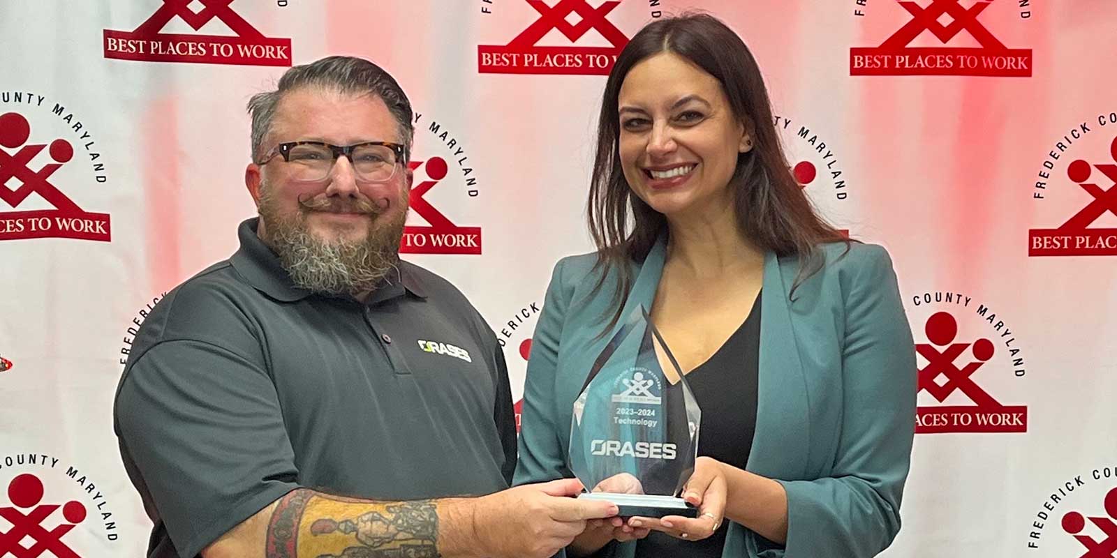 Orases team accepts Frederick best place to work award