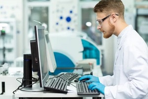 lab technician working in computer system