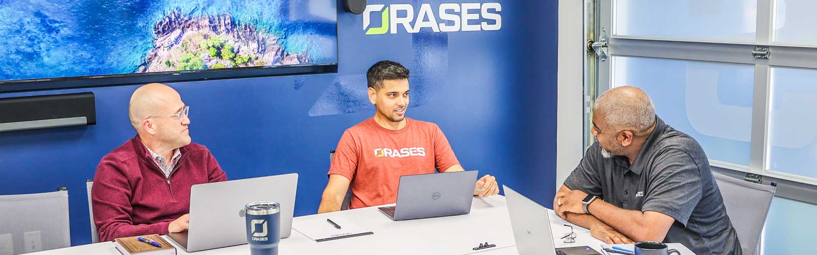 Orases employees discussing new custom software project