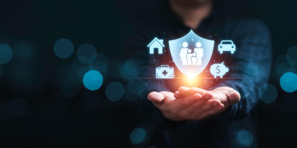 businessman holding and giving insurance and assurance icon including family health real estate car and financial for risk management concept