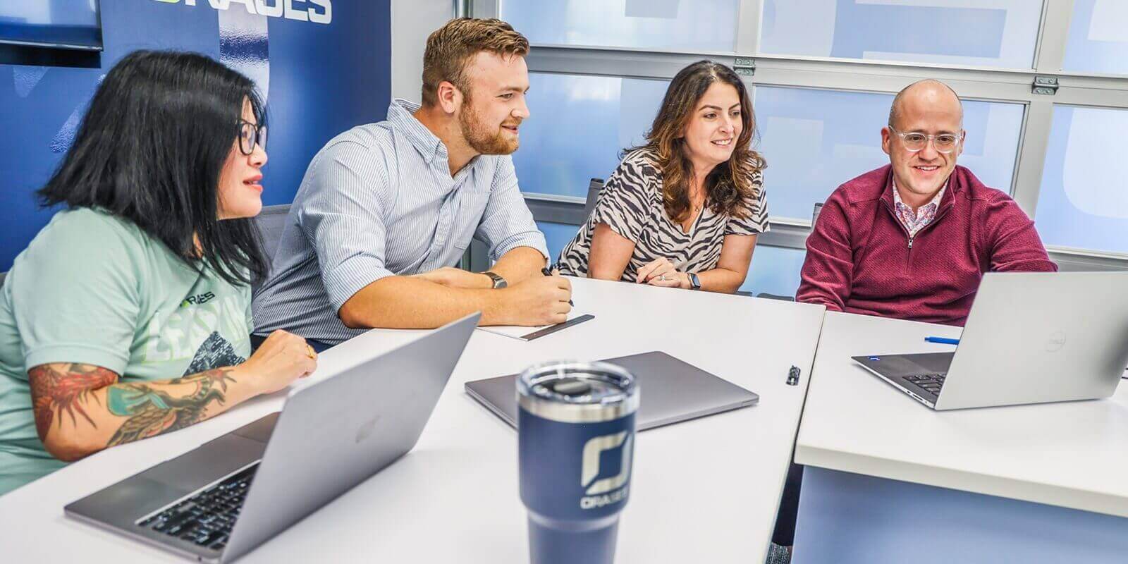 orases team members during meeting