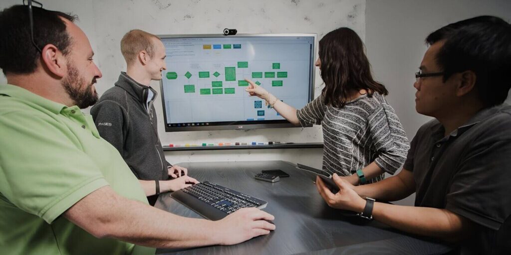 team working on data management presnetation