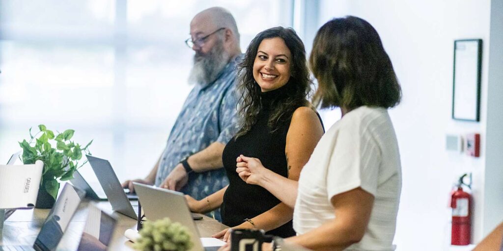 orases employees discussing custom software tools