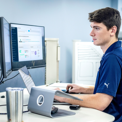A young man at his computer.