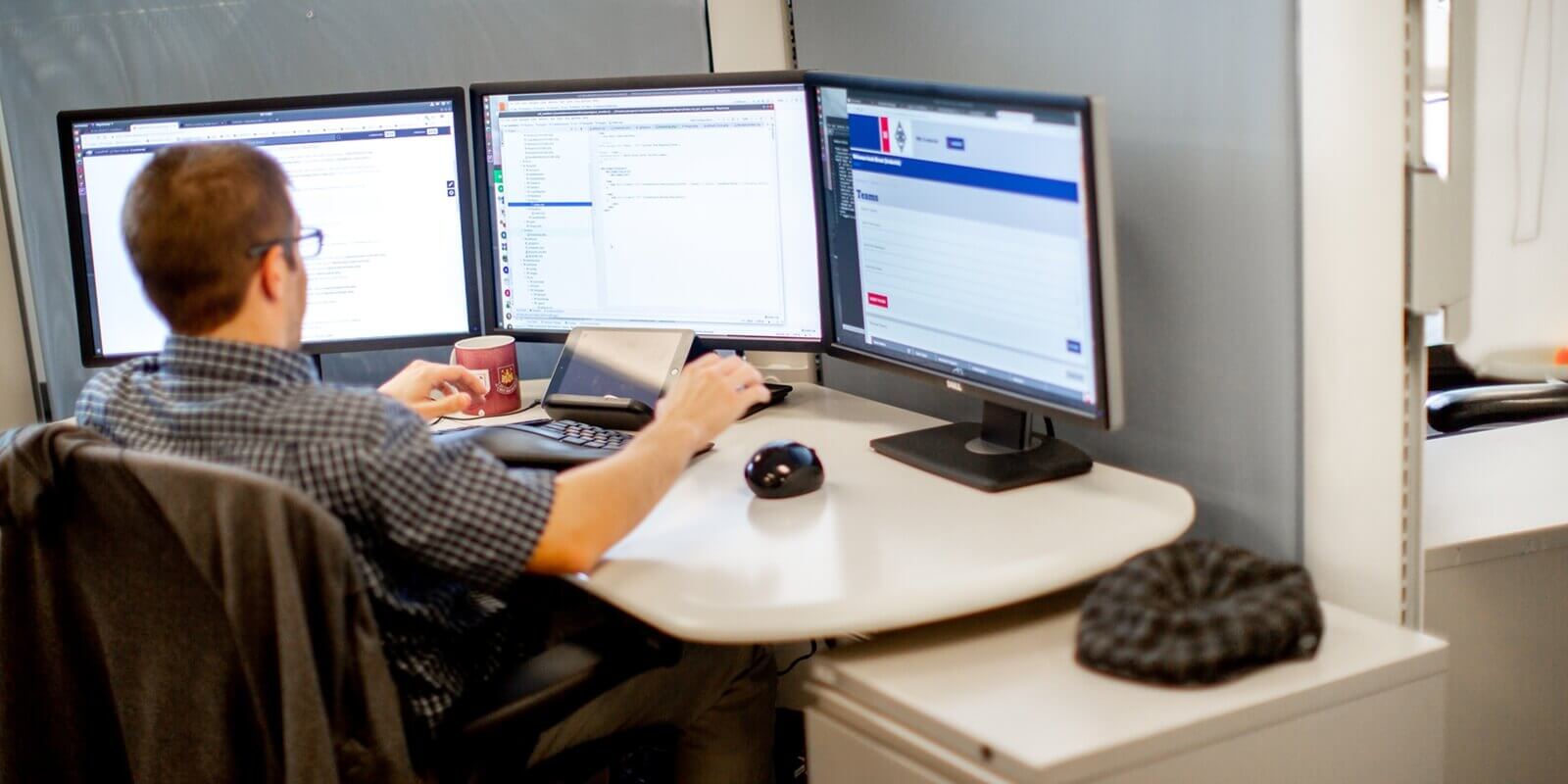 orases developer working on triple screen system