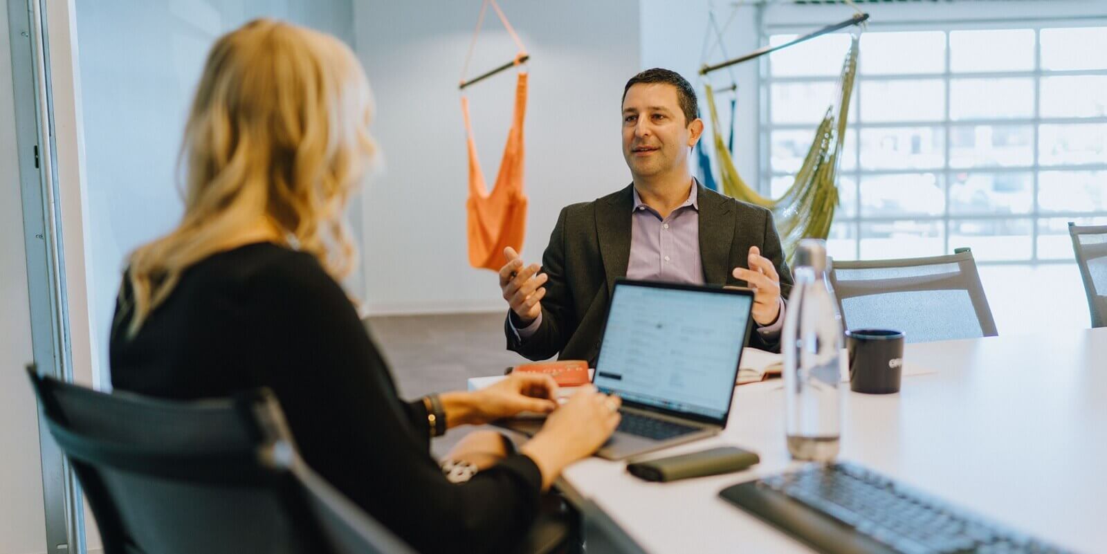 orases members in a meeting