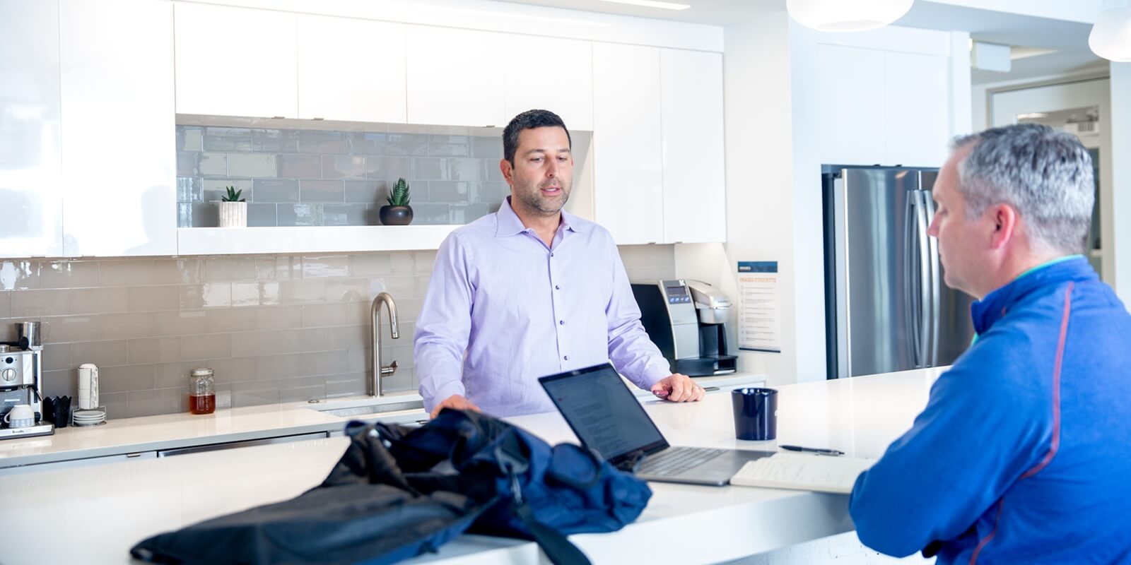 two business people during casual office talk
