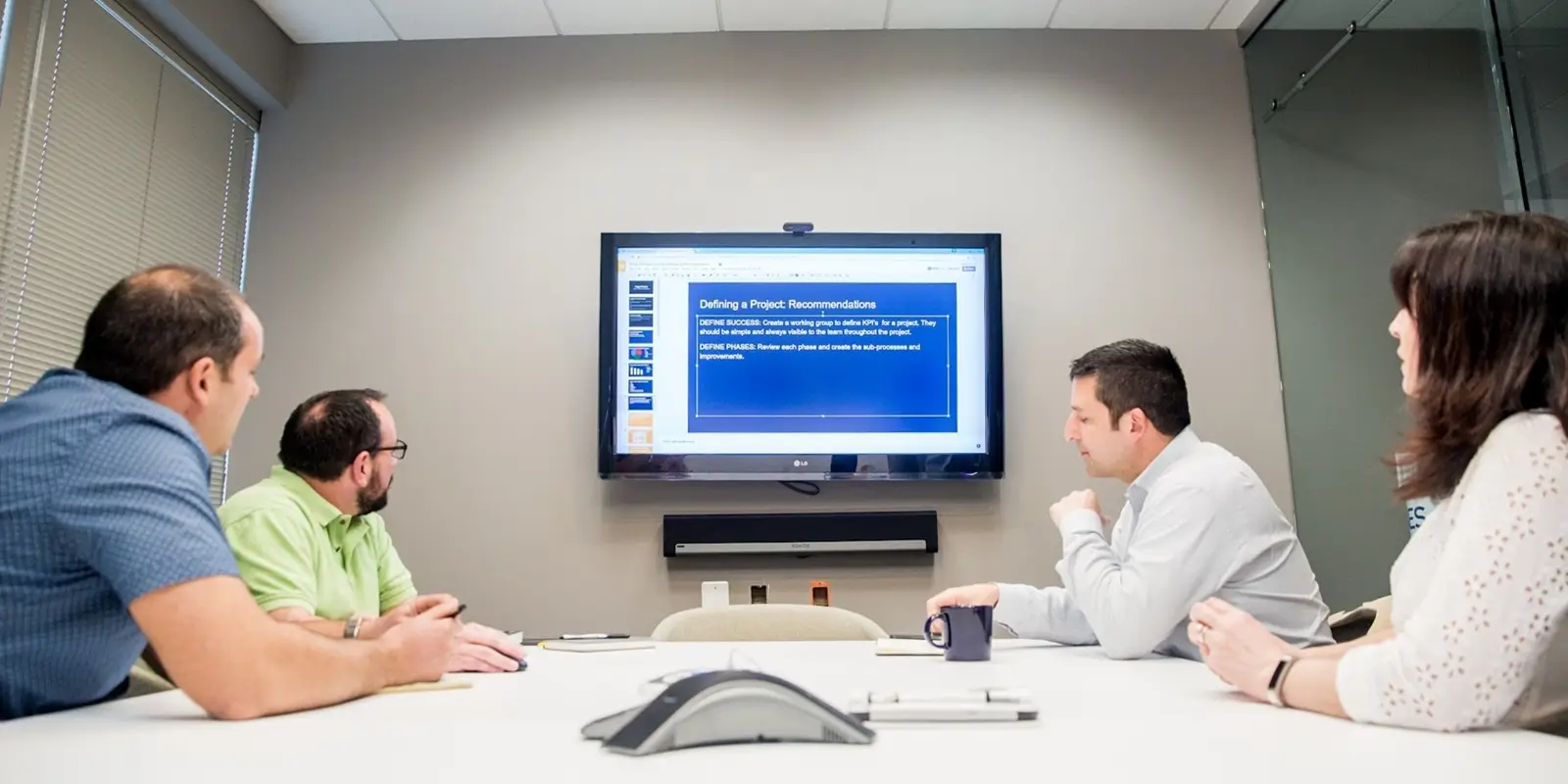 busy team during new Smart Meeting Transcriber & Action Item Generator project presentation