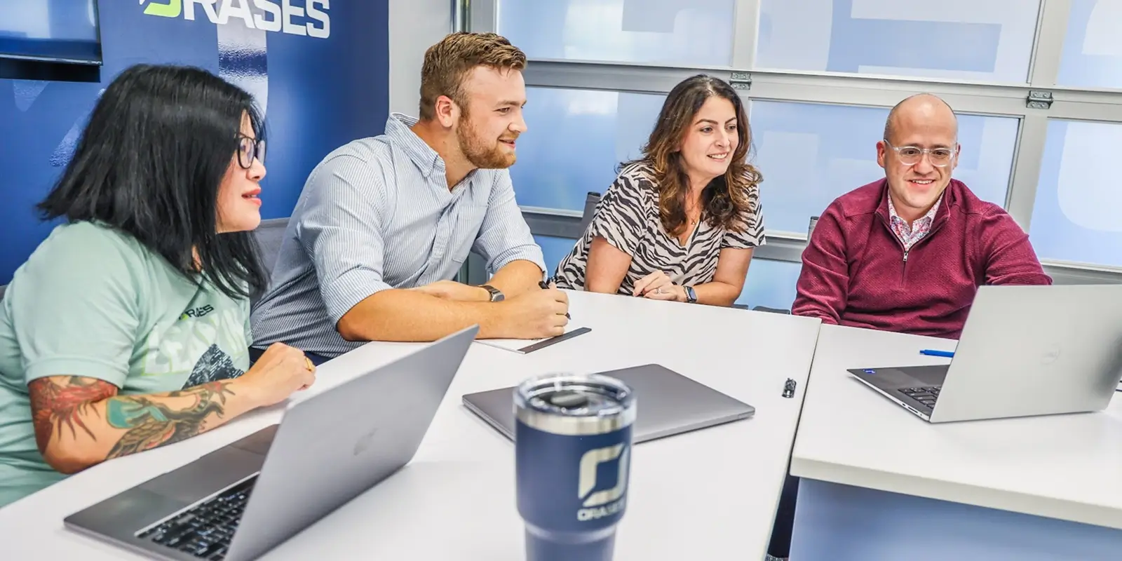 orases team members in a meeting